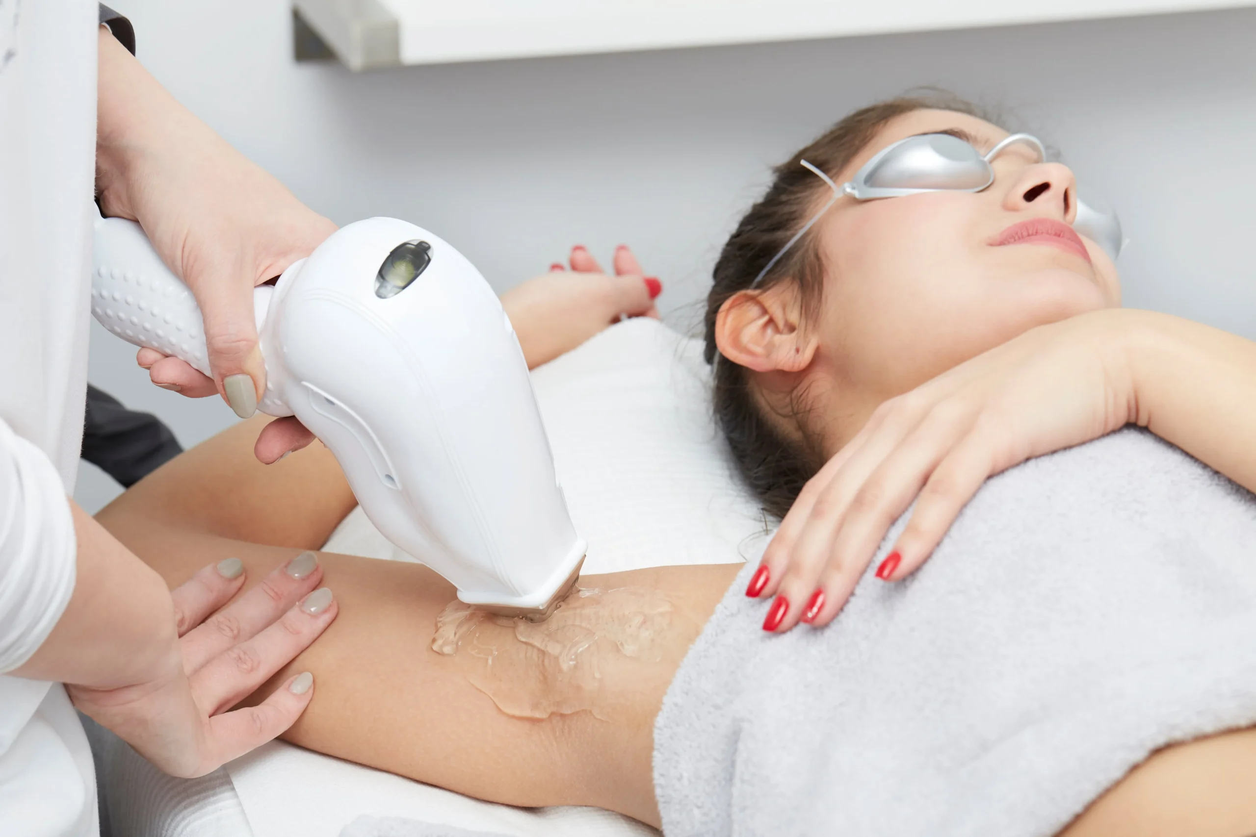 a woman receiving laser hair removal