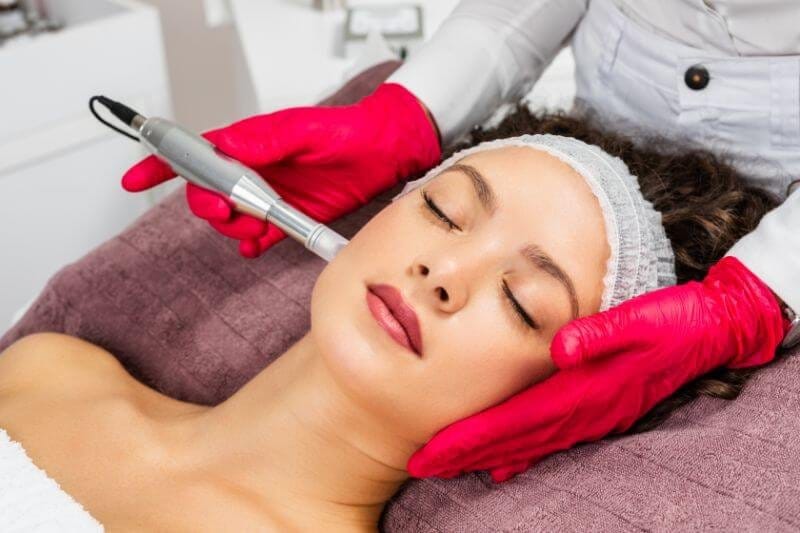 a woman getting a face massage